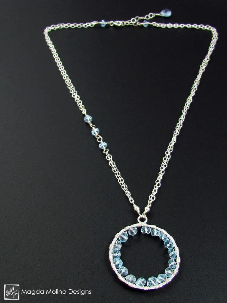 The Infinity Circle Hammered Silver Necklace With Blue Topaz Gemstones