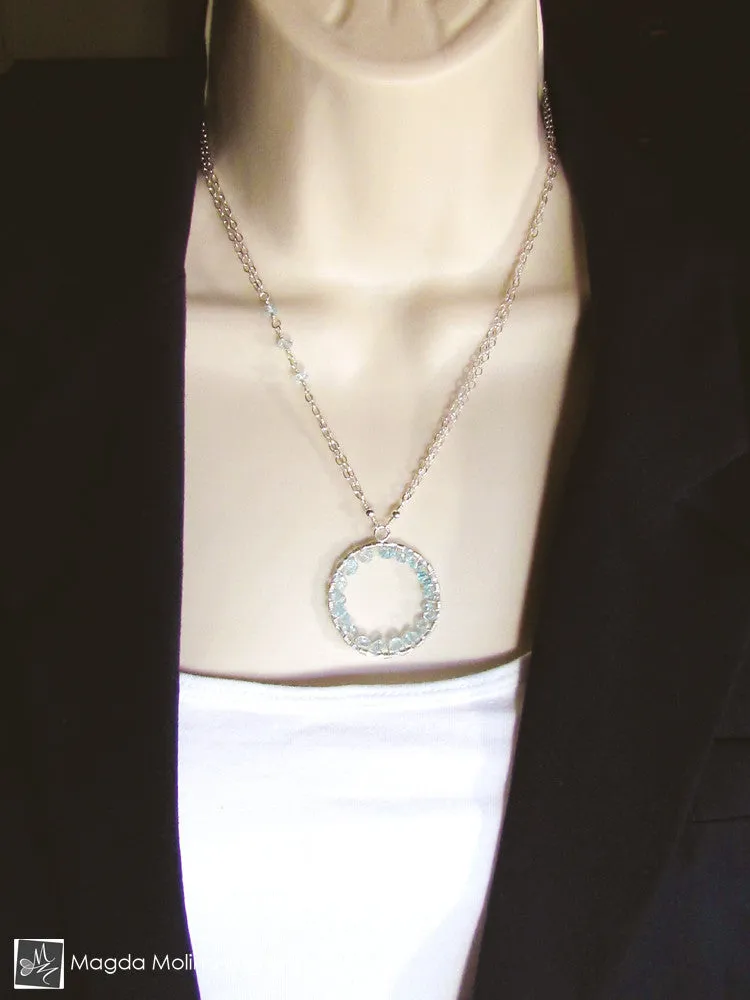 The Infinity Circle Hammered Silver Necklace With Blue Topaz Gemstones