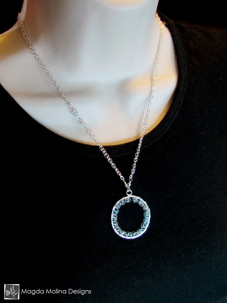 The Infinity Circle Hammered Silver Necklace With Blue Topaz Gemstones