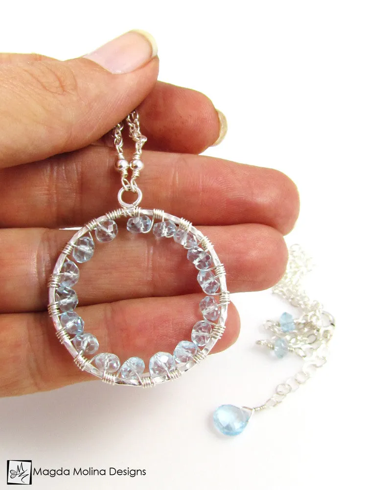 The Infinity Circle Hammered Silver Necklace With Blue Topaz Gemstones