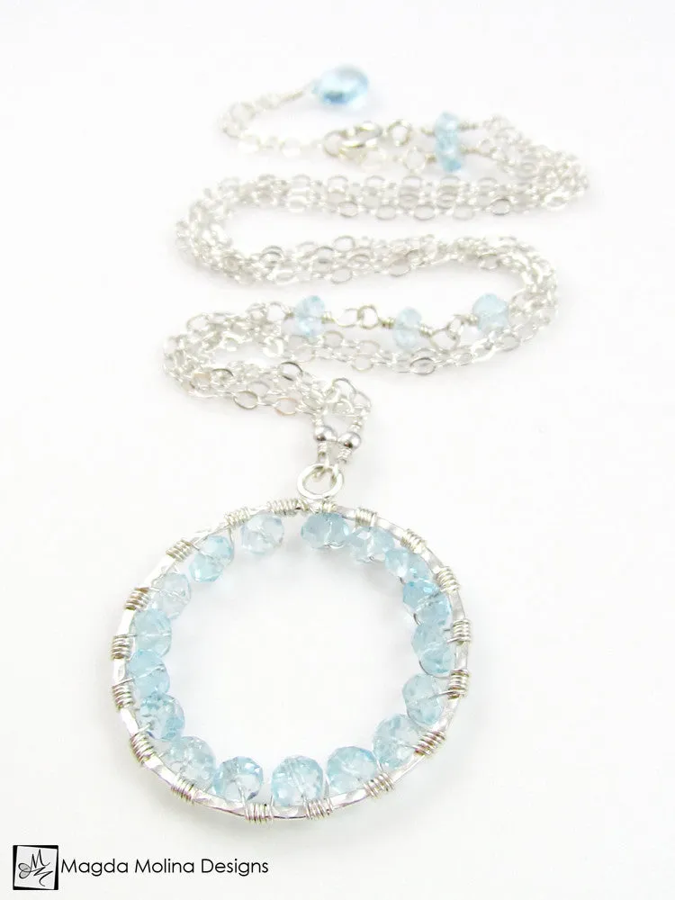 The Infinity Circle Hammered Silver Necklace With Blue Topaz Gemstones
